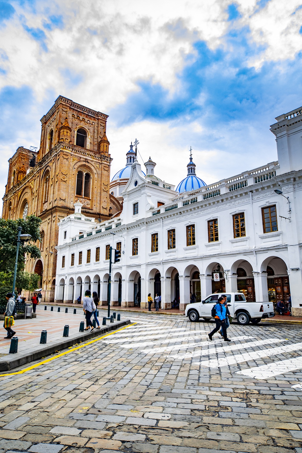 Cuenca's iconic blue-domed cathedral overlooking the main plaza at sunset